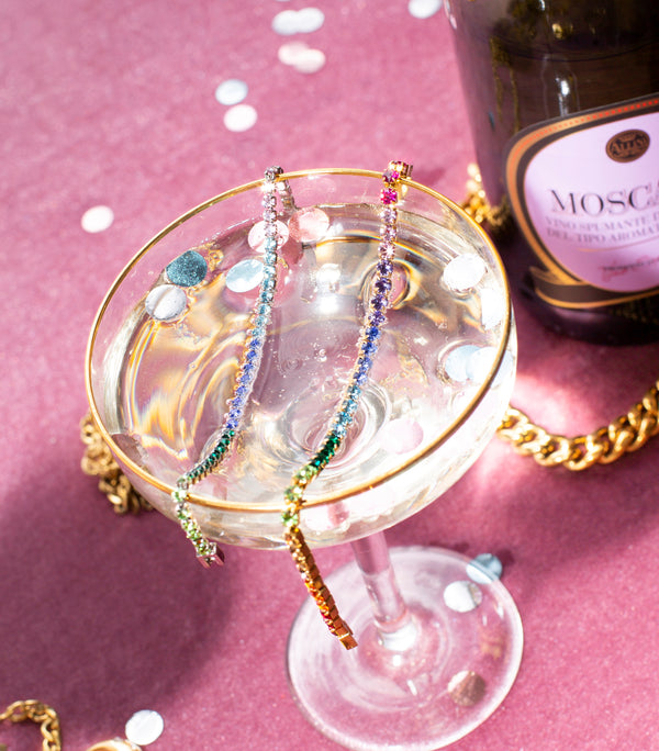 Waterproof Swarovski Bracelets inside a glass of champagne